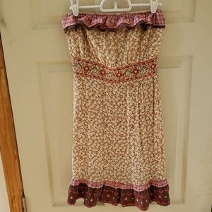 Floral dress with flower print trim.